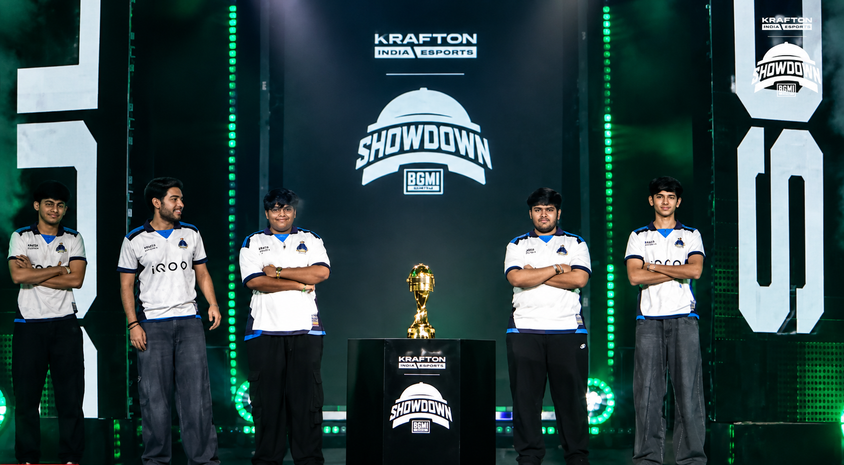 BGMI esports players stand beside the trophy on the BMSD 2026 Grand Finals stage.