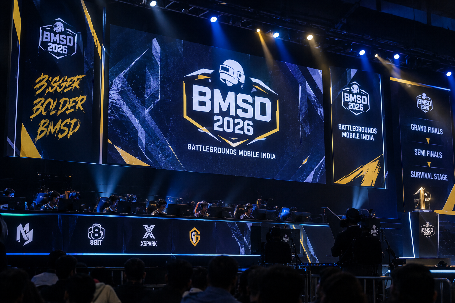 BGMI esports player competing on stage during BMSD 2026, with a large tournament screen and blue-lit arena in the background.