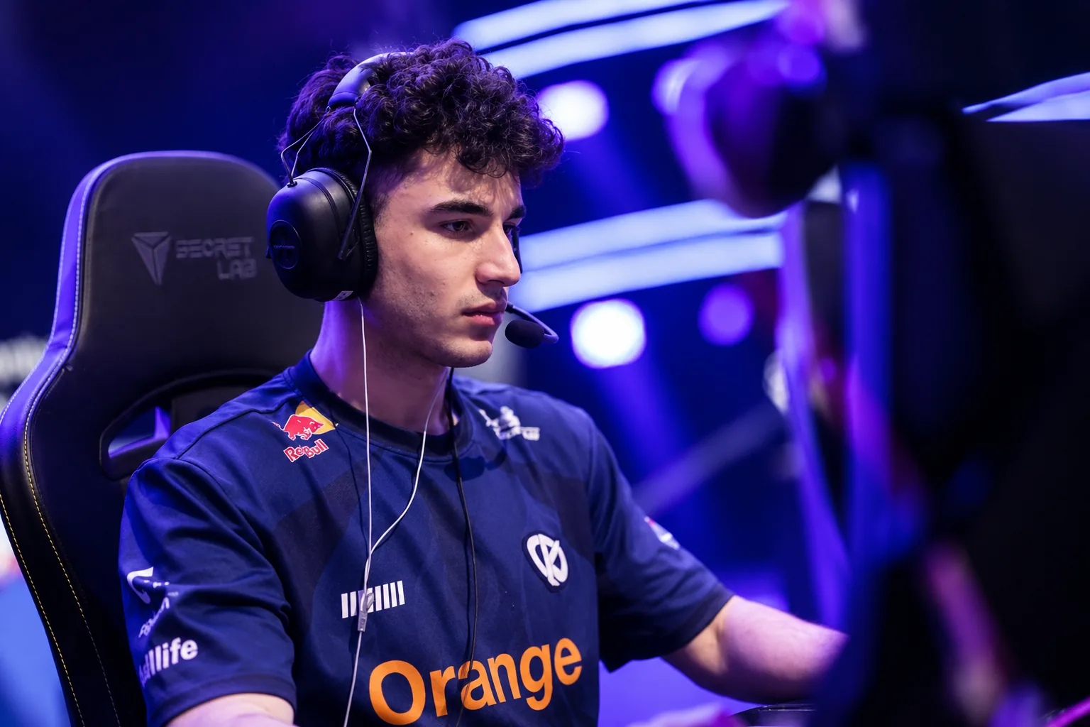 3XA wearing an SK Gaming jersey during a professional League of Legends esports event under purple stage lighting.
